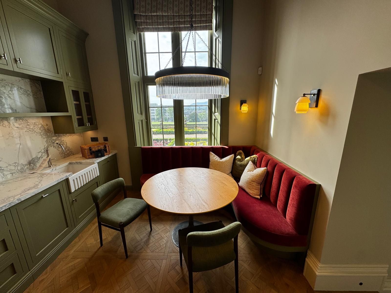 Dining nook with wall lights and a feature pendant
