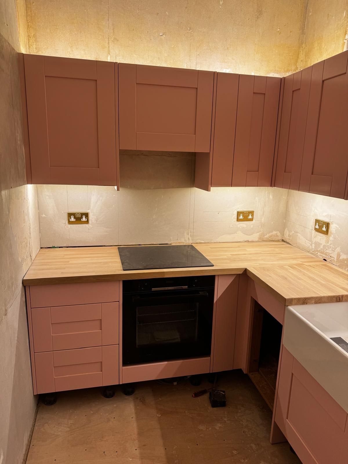 Kitchen with under-cabinet lighting and new sockets